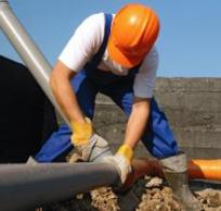 John is attaching a commercial sewer drain line